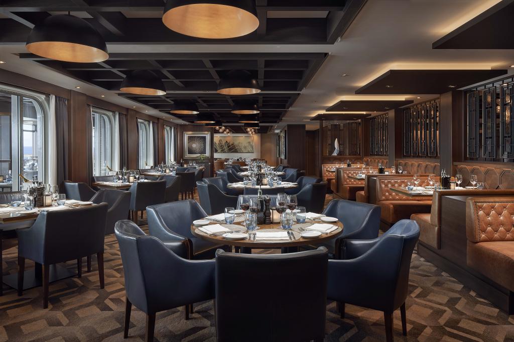 Dining room with plush leather seating on Norwegian Joy
