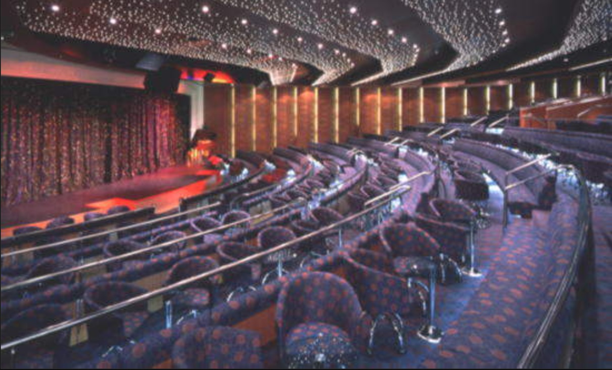 Cruise ship theatre from Ambassador Ambition with seats and railings. 